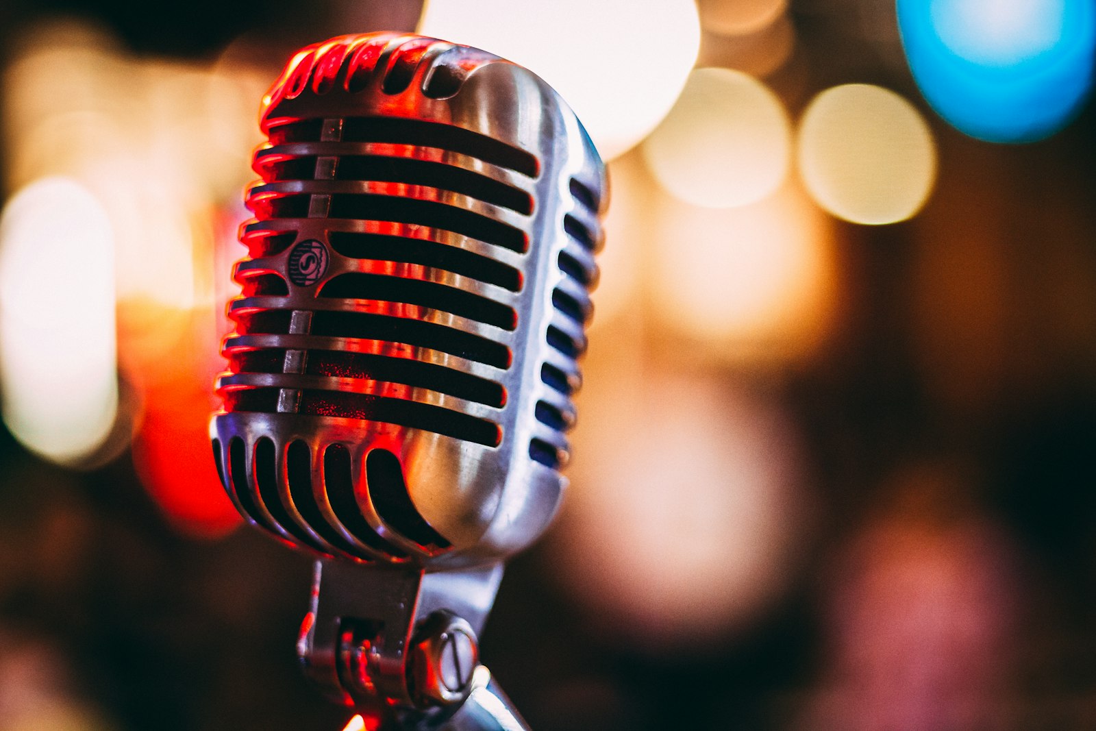 Vintage microphone under warm stage light